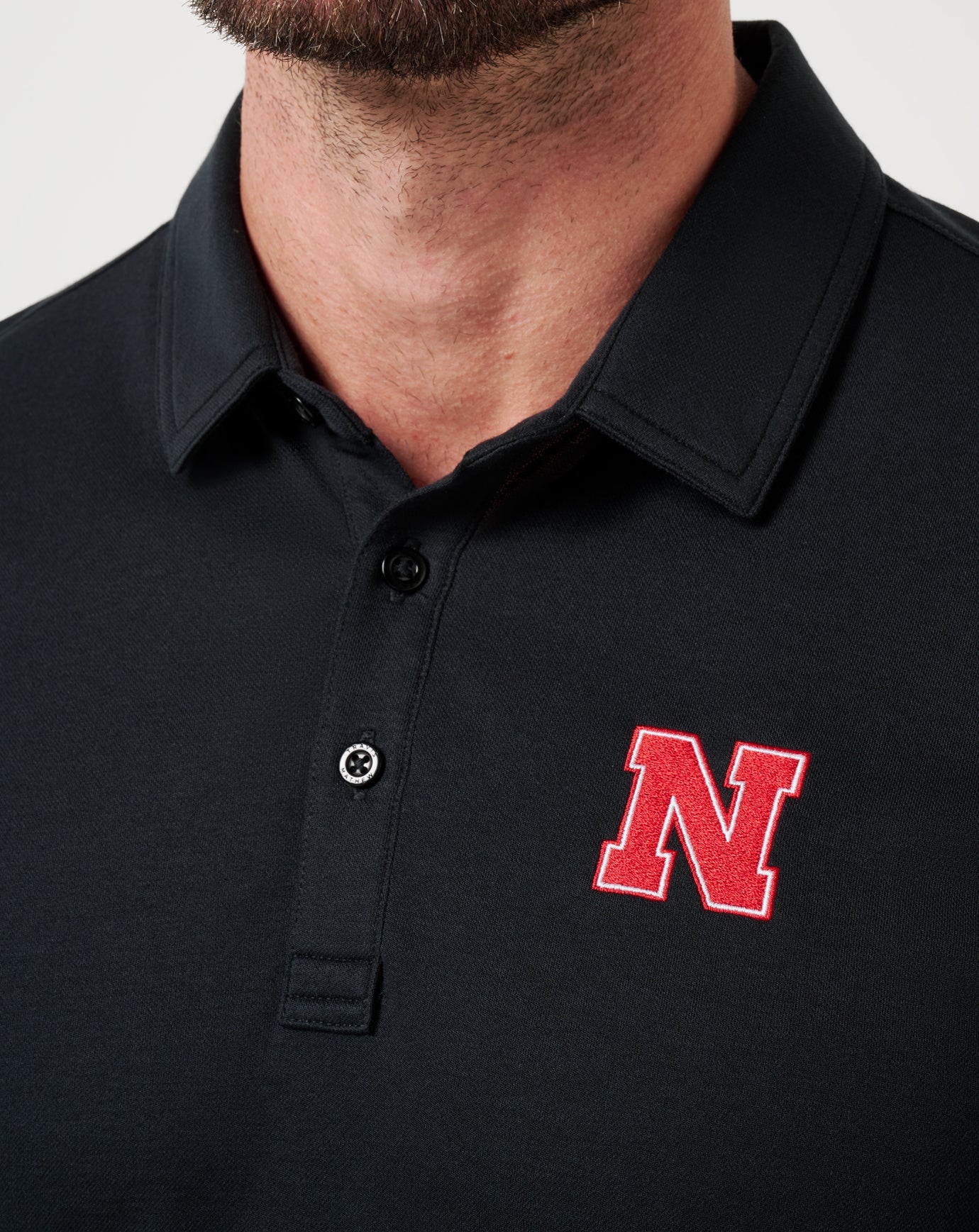 Travis Mathew Hot sale | Nebraska School Pride Polo